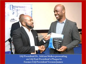 VERNON JAMES RECEIVING PLAQUE FROM DR ADRIAN STOKES